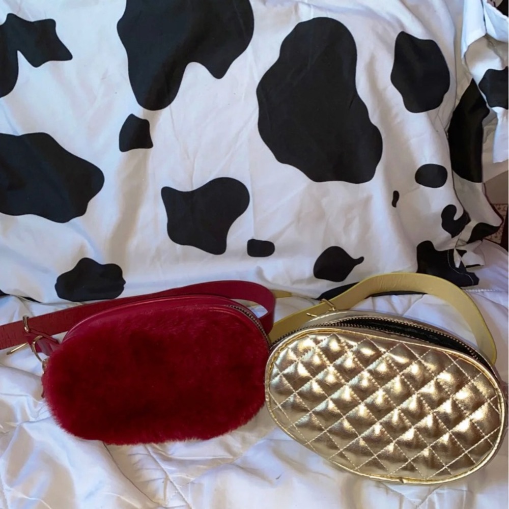 A red fluffy Fanny pack and a gold fanny pack.